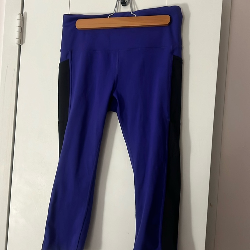 Purple with black stripe on side active capris by Xersion (JCPenney) size medium